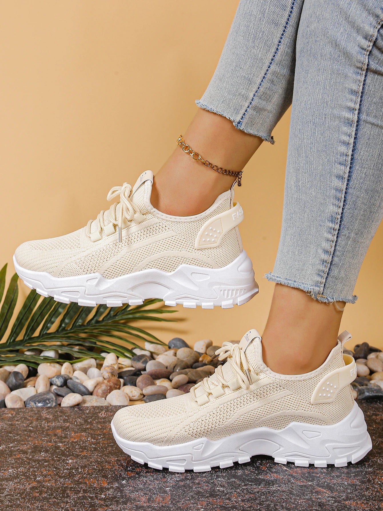 Women's breathable mesh athletic sneakers with thick white sole and cream-beige knit upper