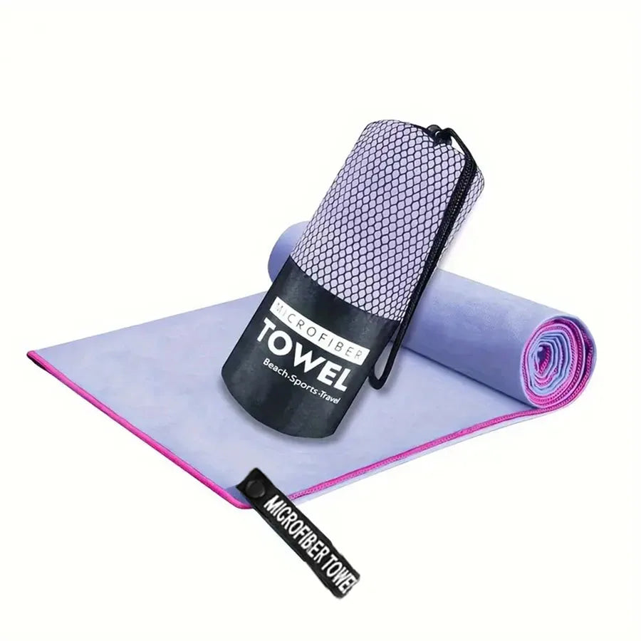 Microfiber yoga gym towel, gray with pink edge, rolled and in black carry pouch