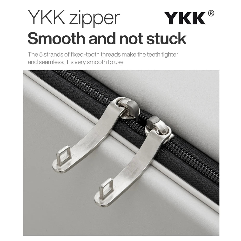 Light gray suitcase zipper detail with metal hooks and black zipper tape