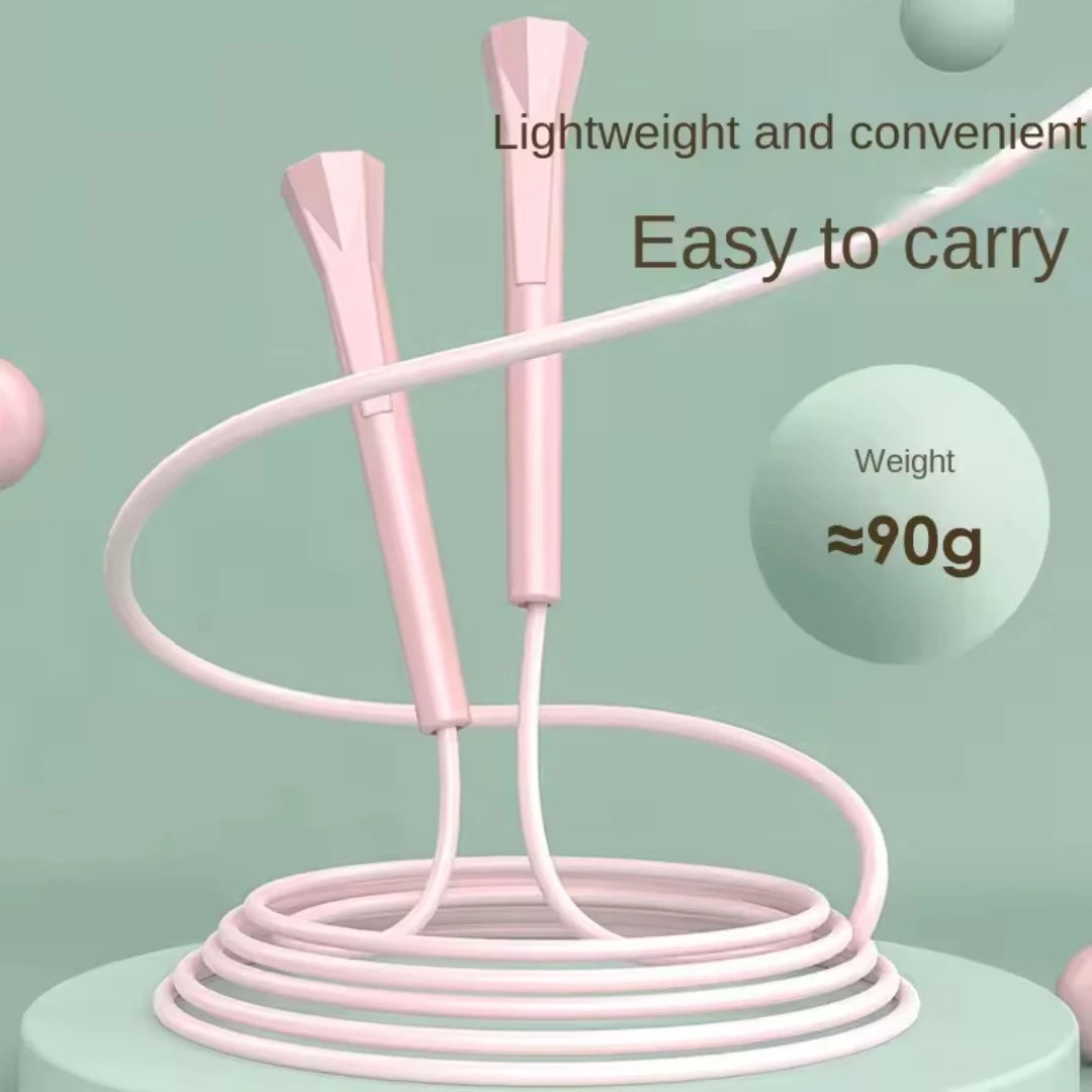 Pink speed jump rope with two foam handles and neatly coiled cable