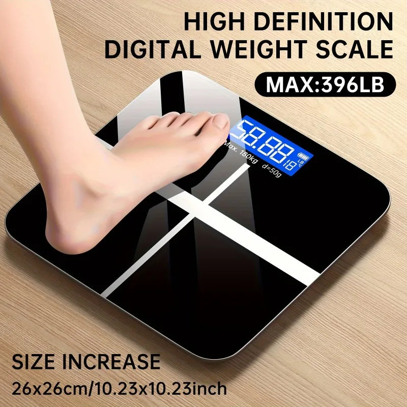 Digital bathroom scale with blue LED display on black glass surface