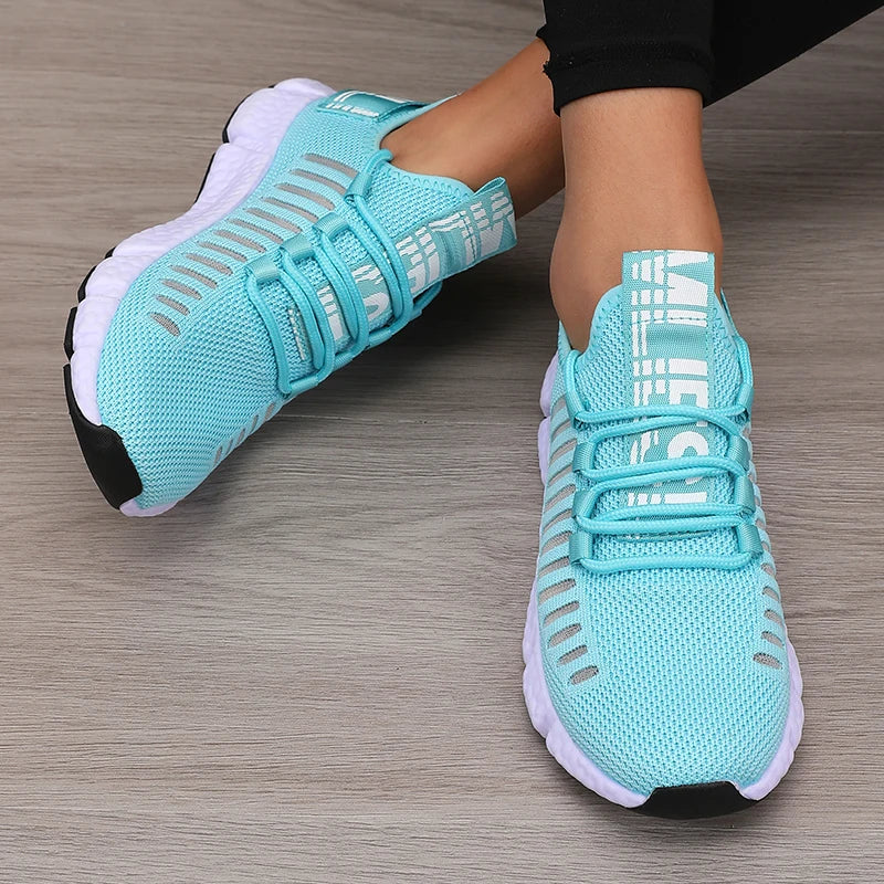 Lightweight running shoes in turquoise blue with white soles and lace-up straps
