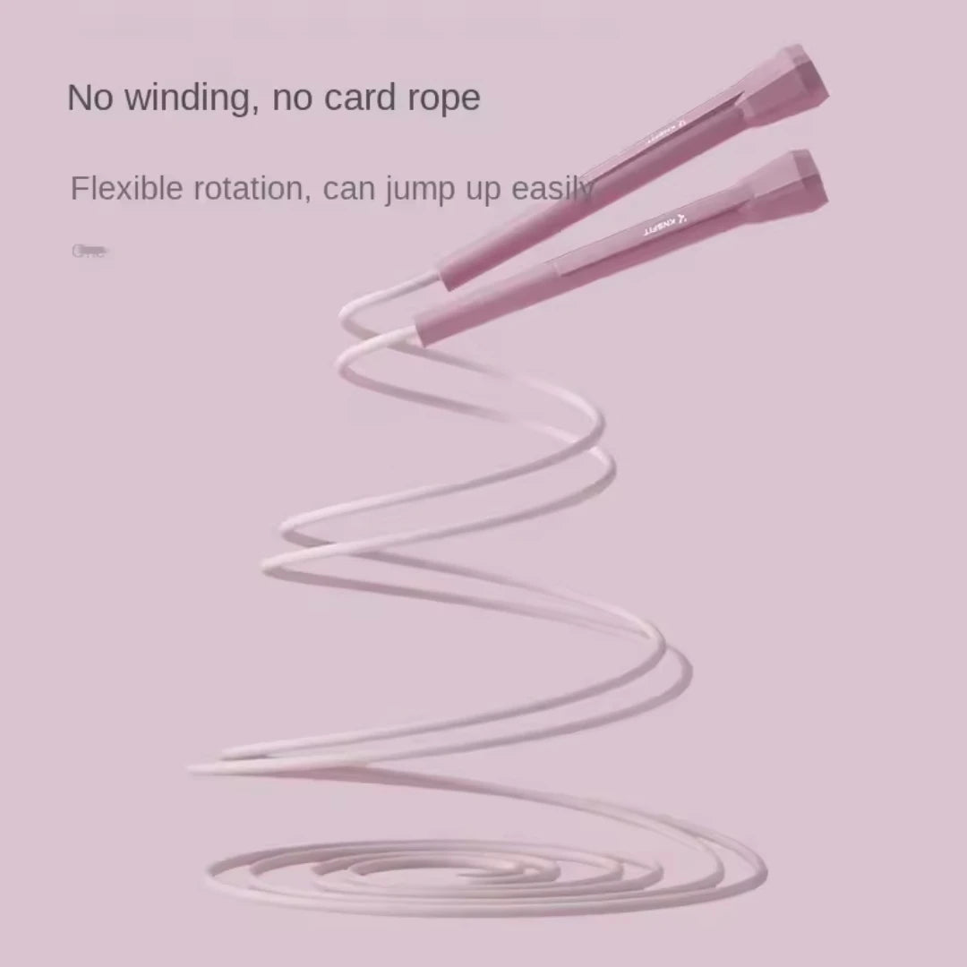 Pale pink speed jump rope with two foam handles and loose coiled cable