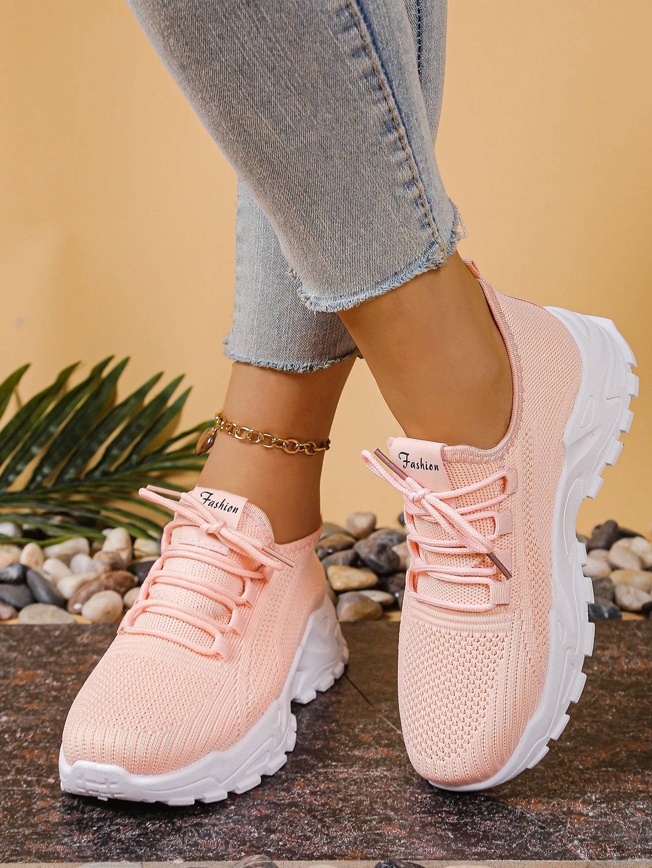 Cedar & Moore women's pink breathable mesh athletic sneakers with a thick white sole and lace-up design.