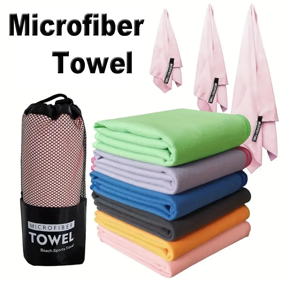 Microfiber yoga gym towel set with stacked green, blue, gray and pink towels