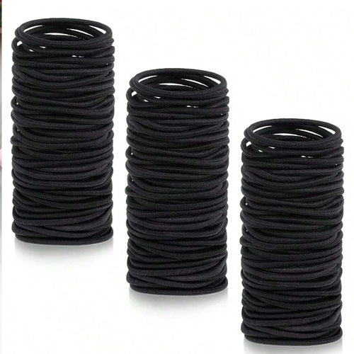 Black hair ties, rolled stack of small ponytail elastic bands