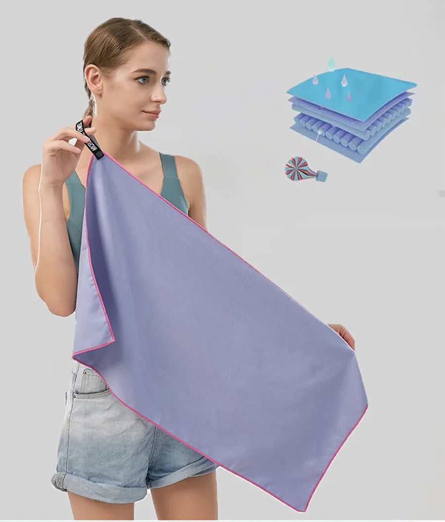 Cedar & Moore quick-dry microfiber sports towel in lavender with pink edge, shown with storage bag graphic