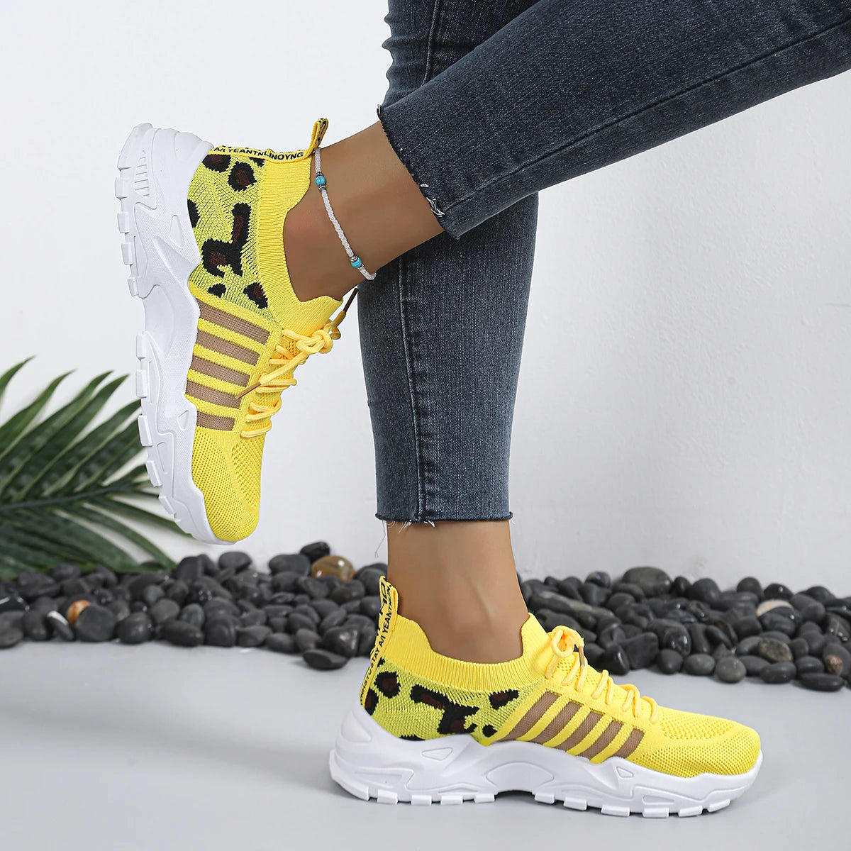 Women's leopard print athletic sneakers by Cedar & Moore, yellow breathable knit with thick white sole