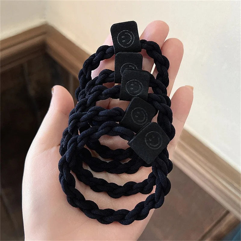 Hair scrunchie set with braided black elastic bands and round logo patches (5 pieces)