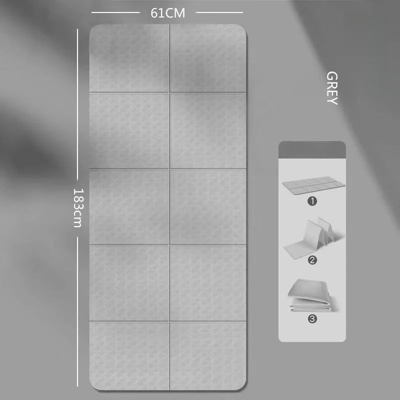 Foldable yoga mat in grey, folded panels with textured non-slip grip surface