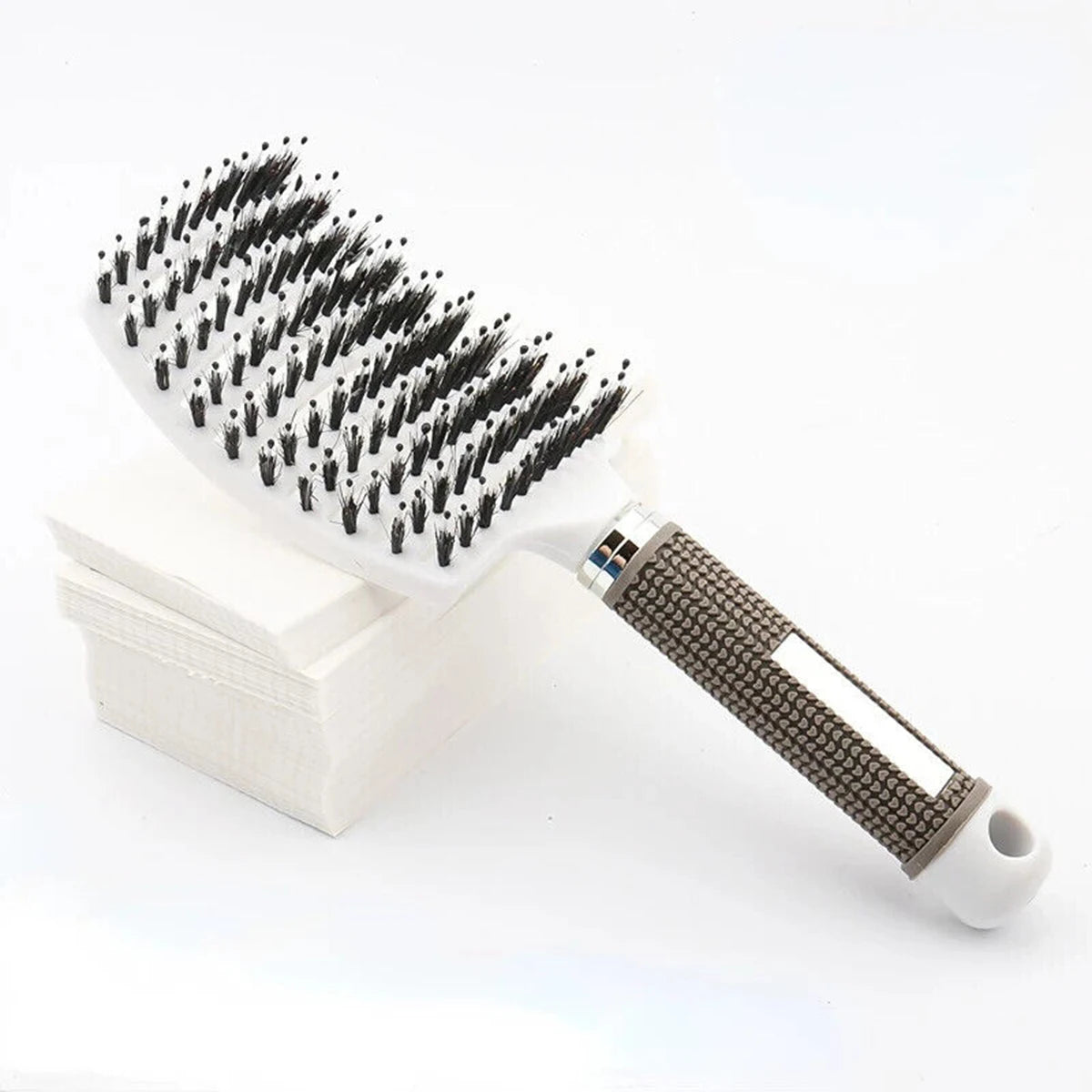 Gray-brown detangling hairbrush with boar bristle pins and white handle