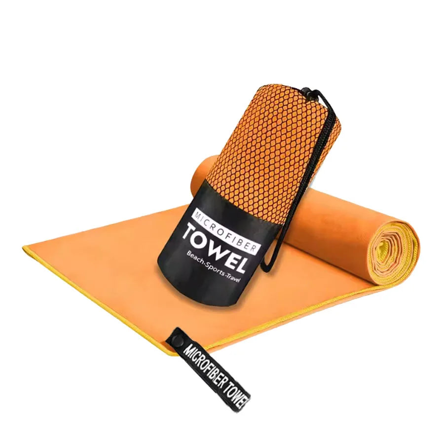 Microfiber yoga gym towel in orange, folded with rolled matching towel