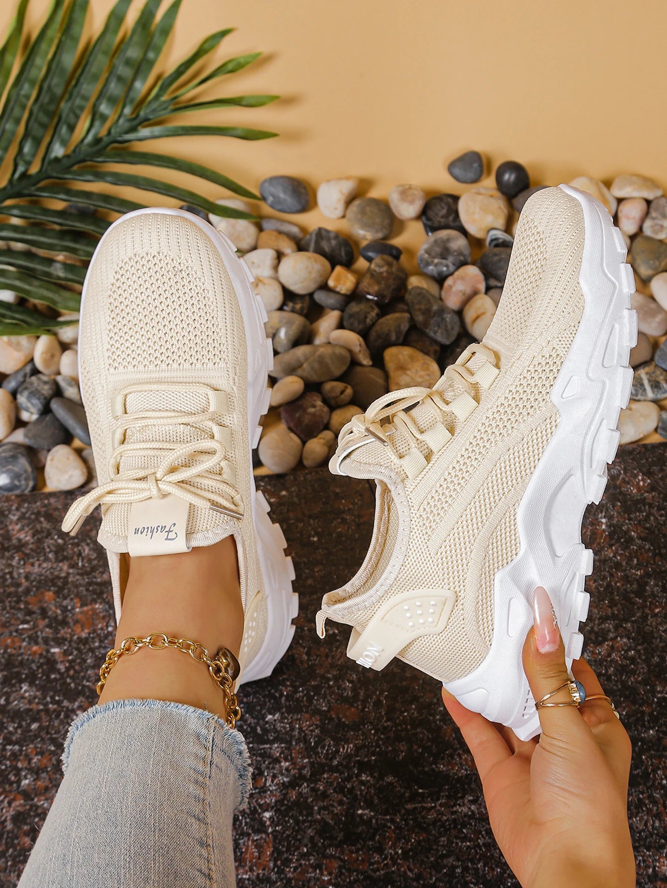 A pair of women's cream mesh athletic sneakers with a thick white sole by Cedar & Moore