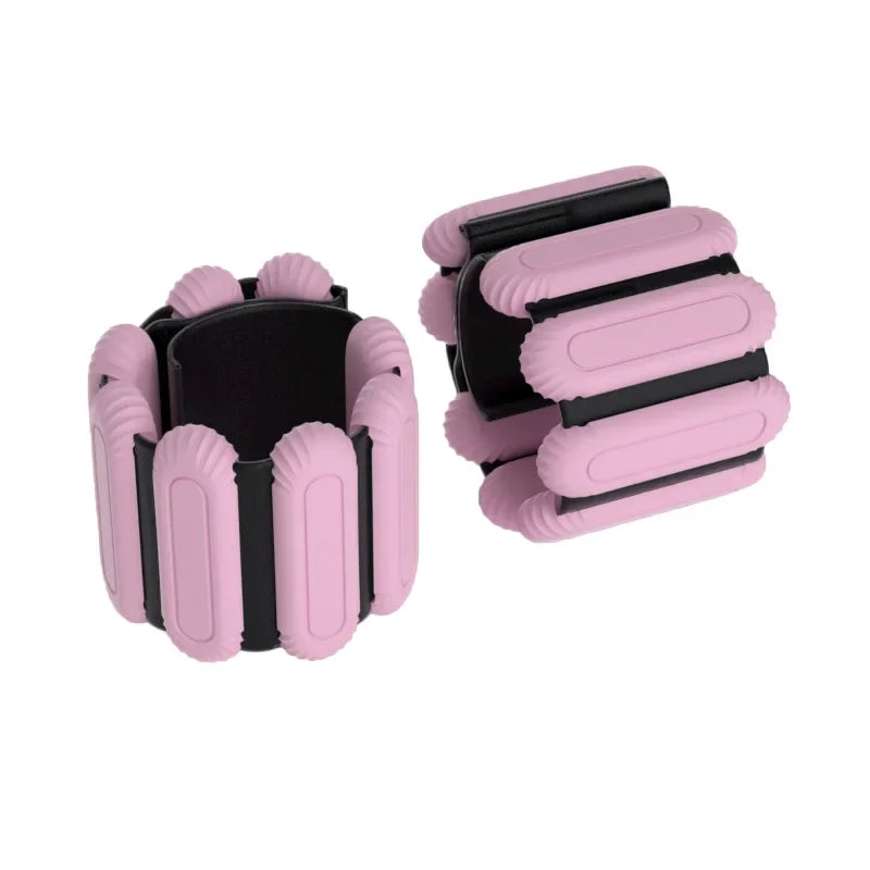 Adjustable wrist weight bands in dark pink with black inserts, two-piece set