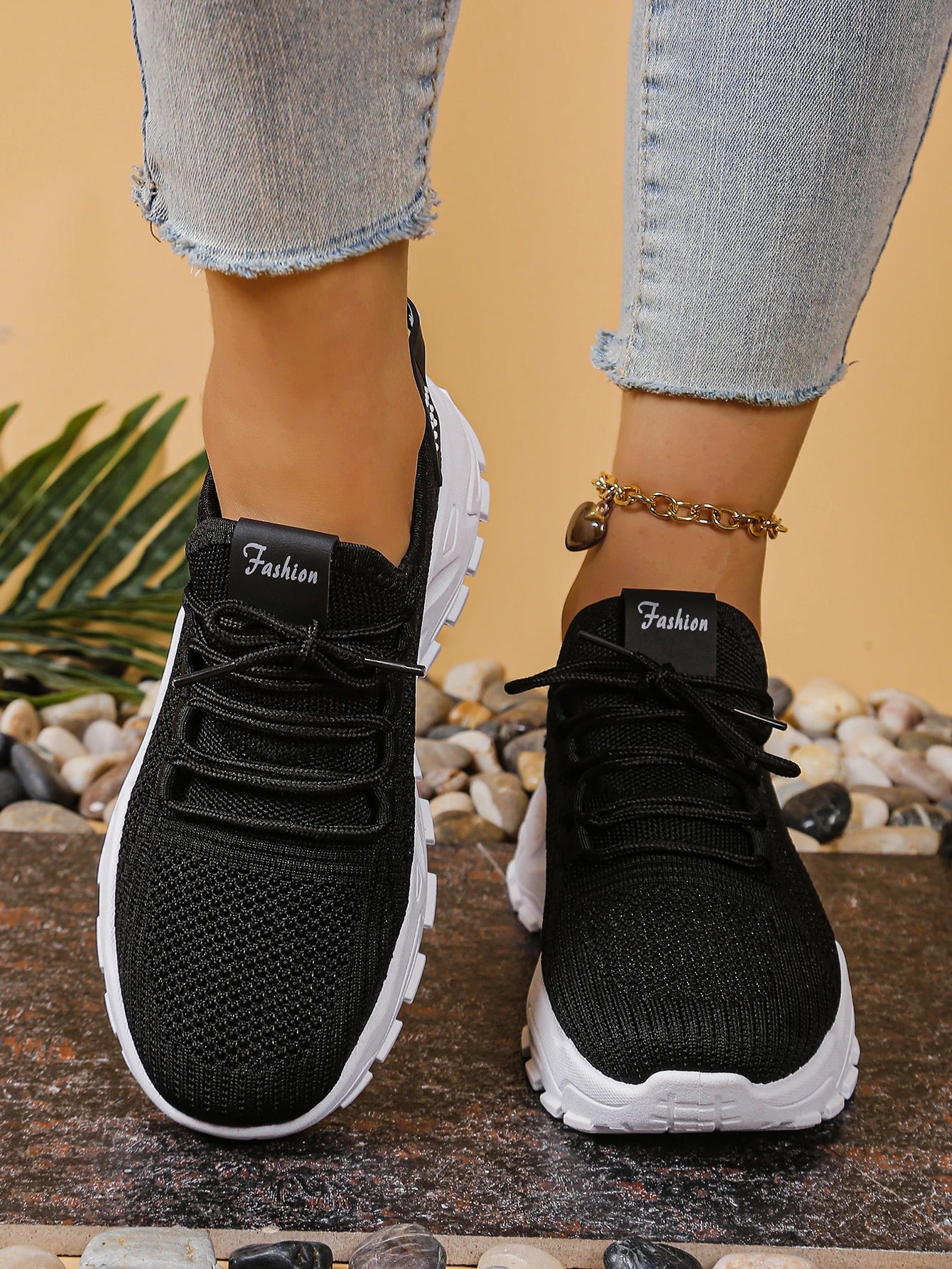 Women's black breathable mesh athletic sneakers with thick white sole