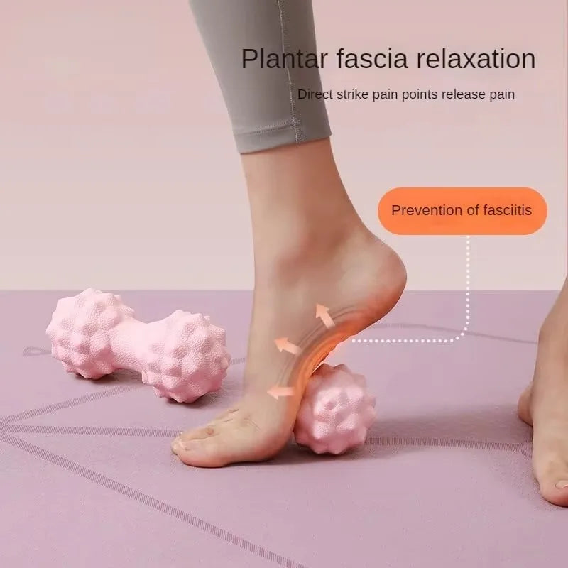 Two pink textured massage balls by Cedar & Moore for dual-therapy foot relief and plantar fascia release