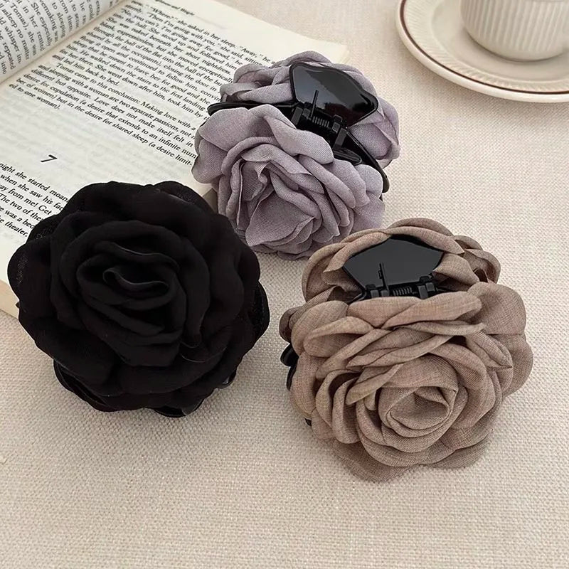 Set of black, gray, and beige fabric rose hair claw clips with barrette backs