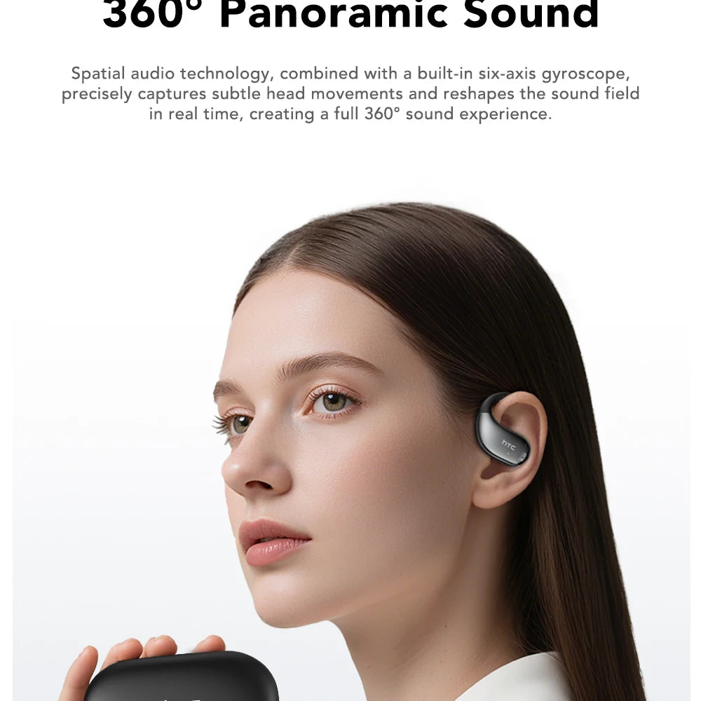 Black wireless earbuds in-ear on a model, spare earbud held nearby