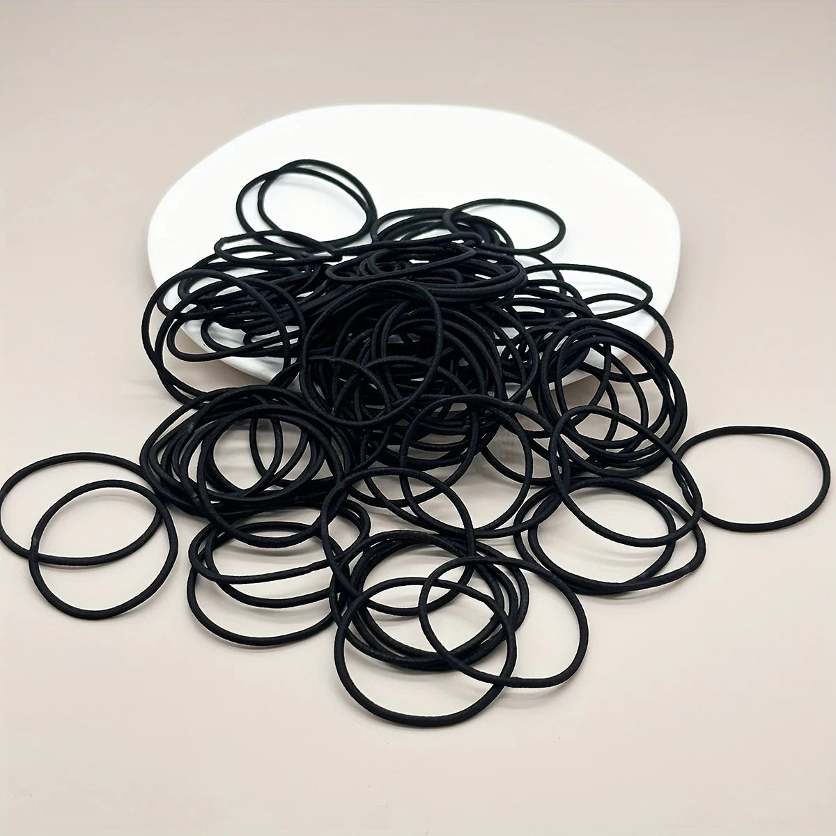 Black hair ties, heap of small elastic loops