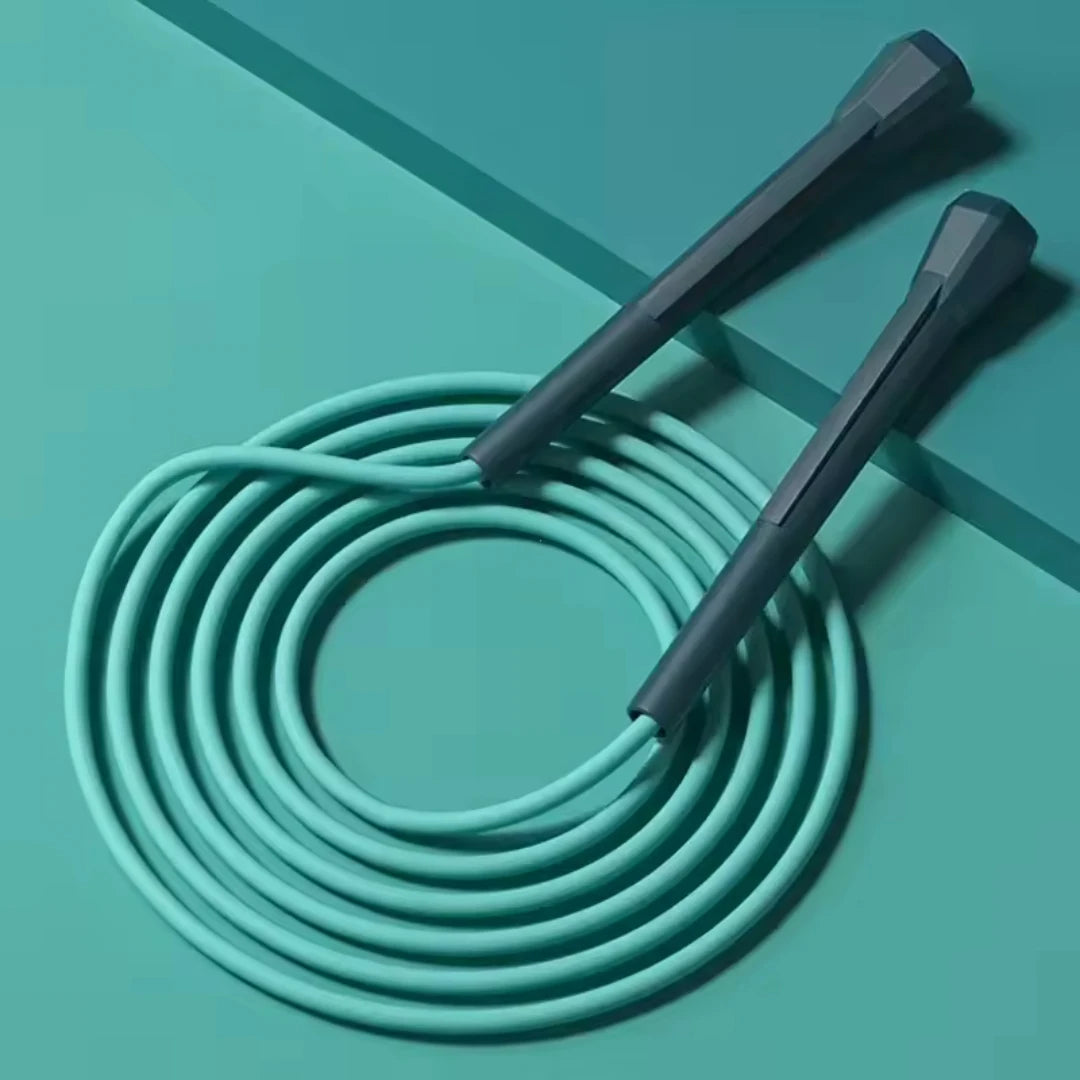 Teal speed jump rope with two handles and a coiled cable loop