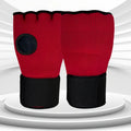 Red half-finger MMA gloves with black wrist strap and circular knuckle pad