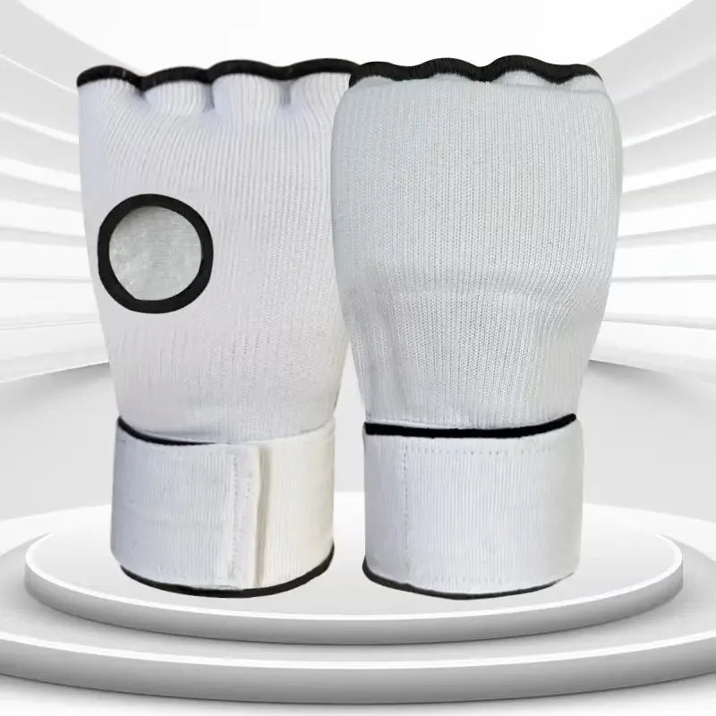 White half-finger MMA gloves with black wrist trim and circular knuckle pad