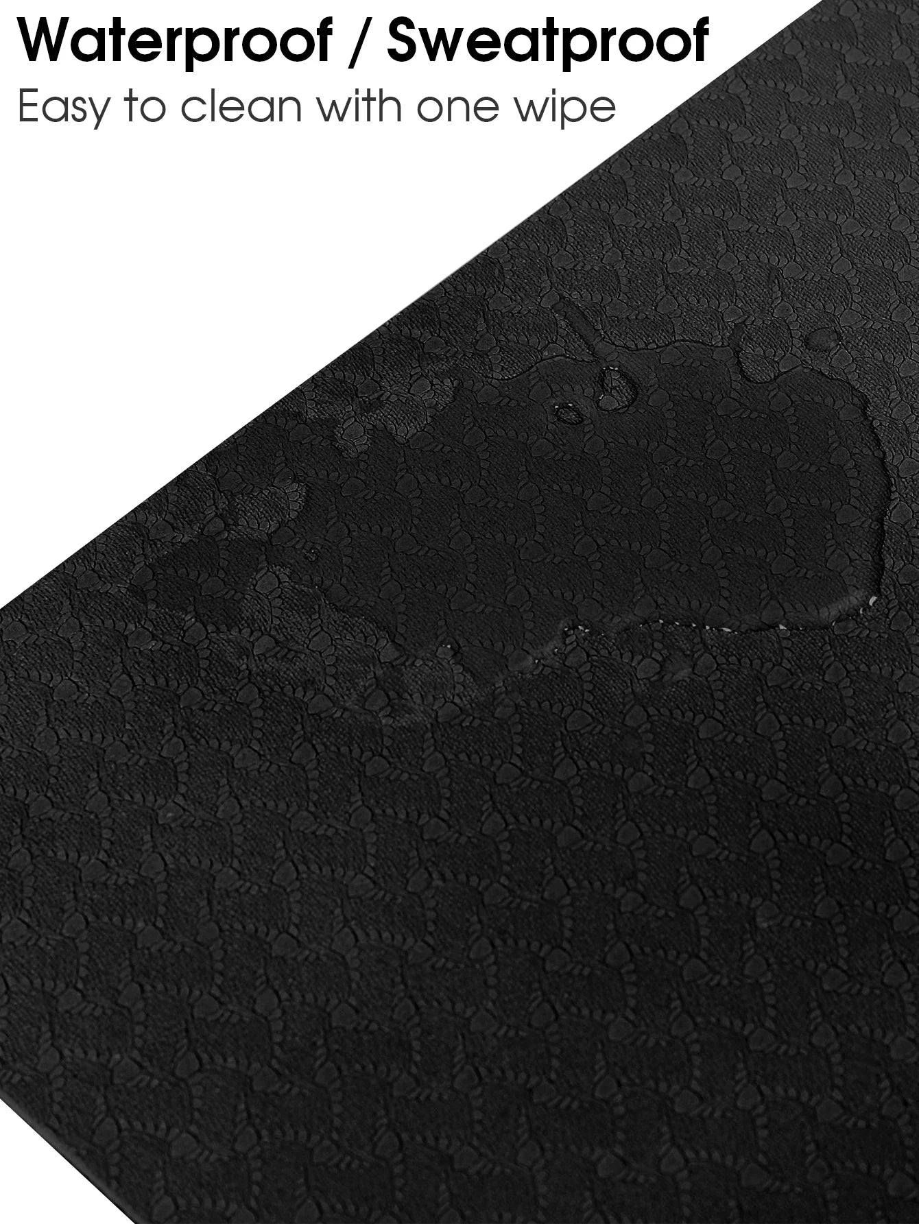 Black textured yoga mat surface with raised pattern for grip.