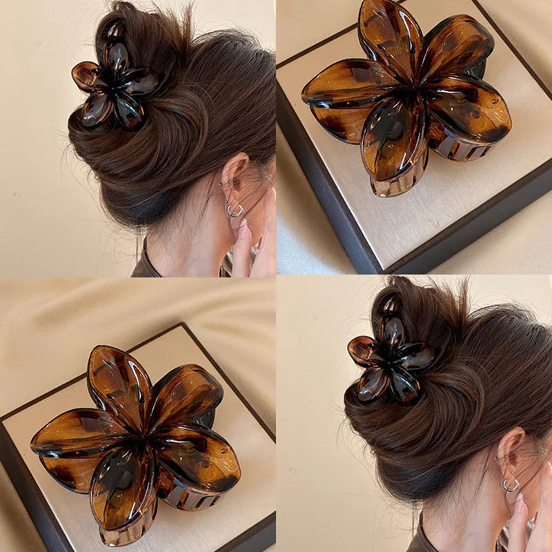 Hawaiian gradient flower hair claw clip in dark tortoiseshell with matching hair styling view