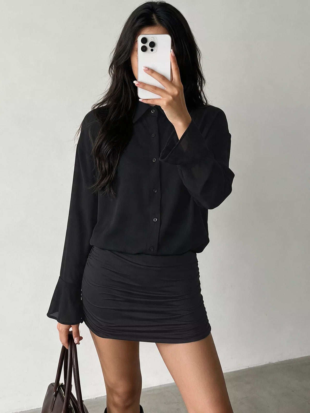 Black button-front ruched mini shirt dress with flared bell sleeves