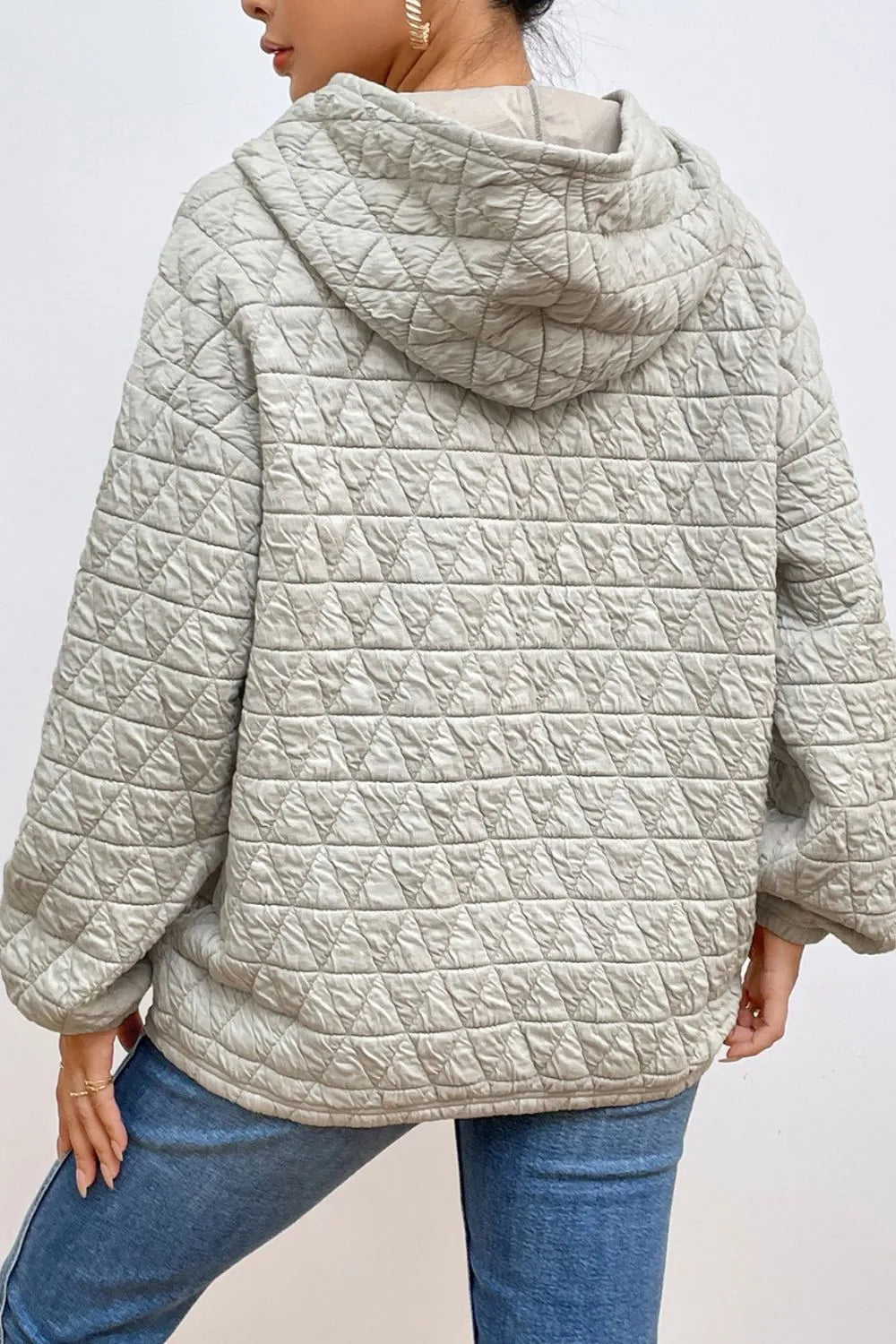 Light gray quilted long-sleeve hoodie with hood, back view, no front pocket shown
