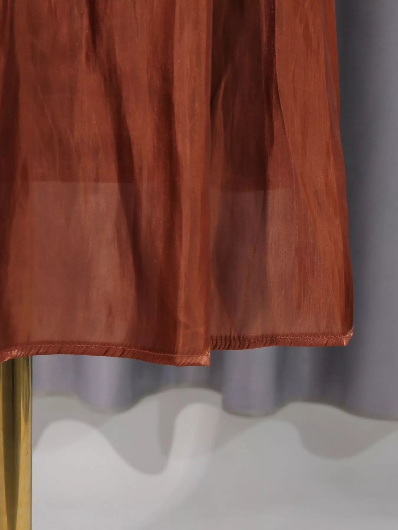Cedar & Moore Front Twisted Draped Long Sleeve Maxi Dress rust color with hem detail