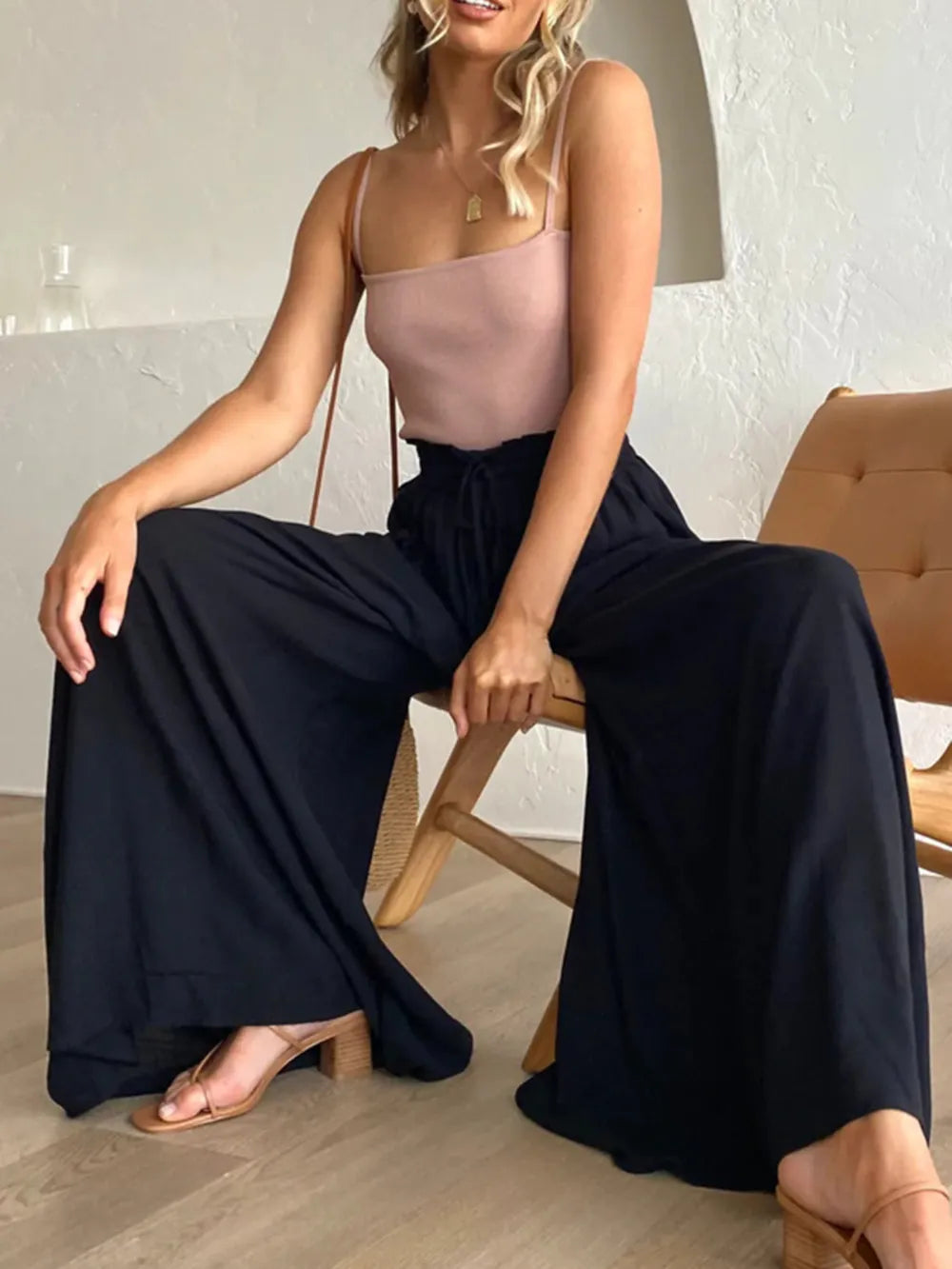 High waist wide leg pants in dark navy with smocked elastic waist and flowing wide legs