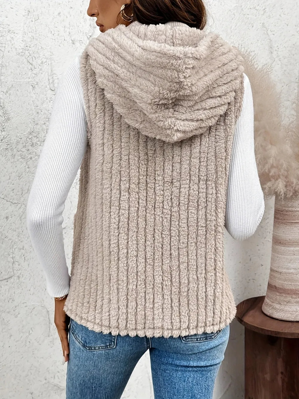 Fuzzy hooded vest, dusty beige textured knit, back view with hood and hem