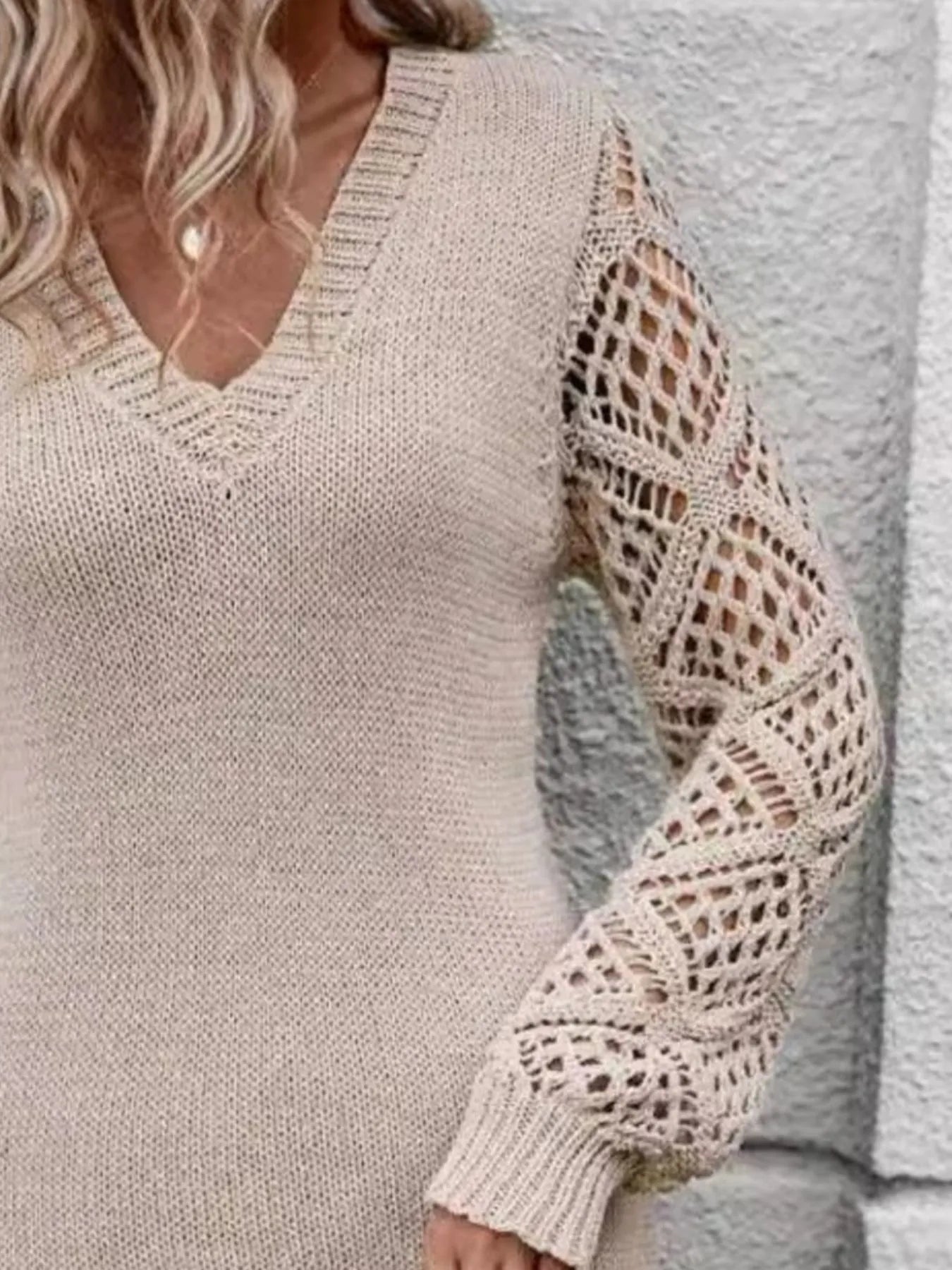 Beige knit sweater dress with hollow-out sleeve pattern