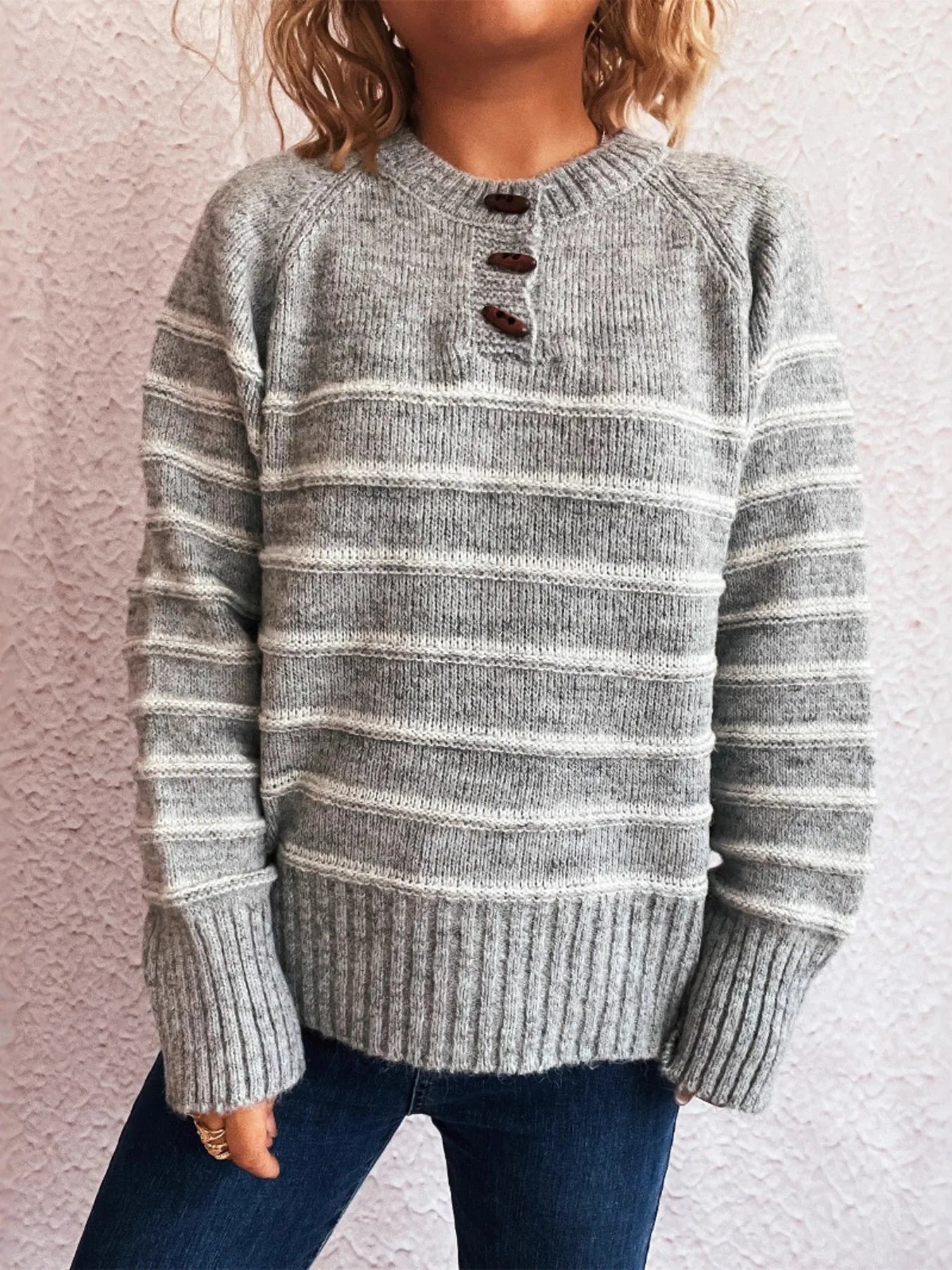 Gray striped knit long-sleeve sweater with button placket, ribbed hem, and cuffs