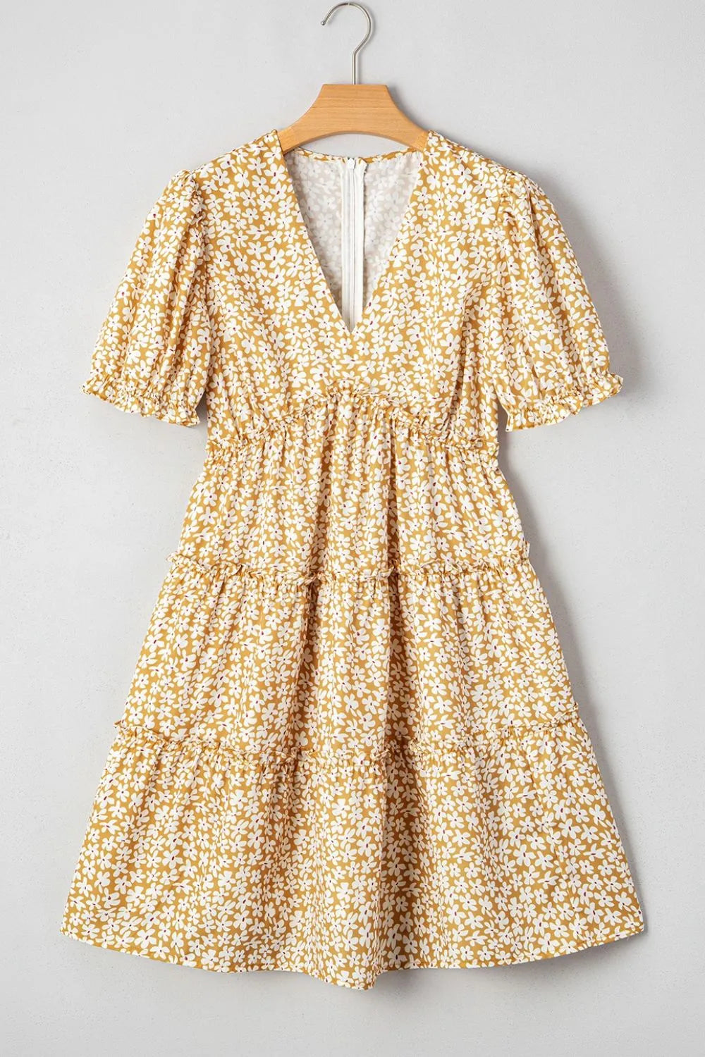 Floral short-sleeve surplice mini dress with frilly tiered skirt in mustard yellow with white flowers