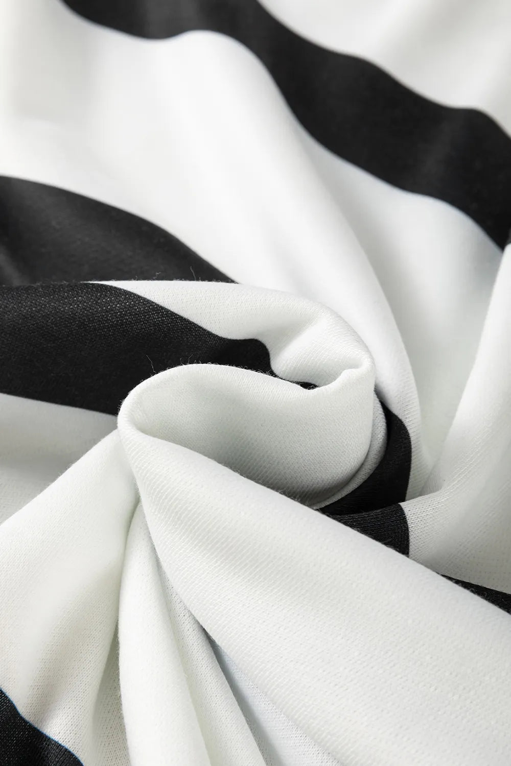 Cream-and-black striped knit fabric fold