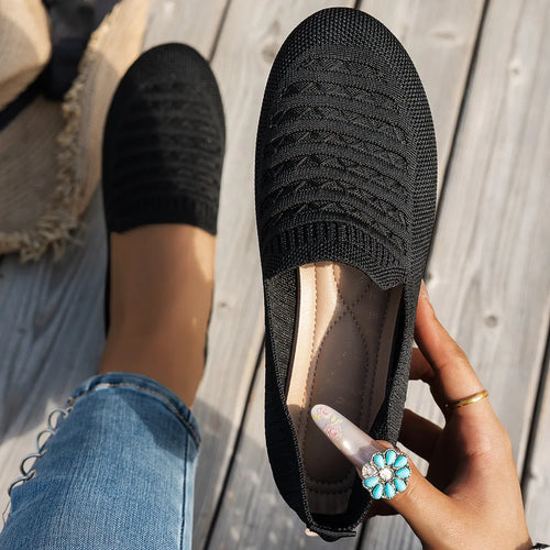 Black knit slip-on loafers, textured rubber sole and elastic collar
