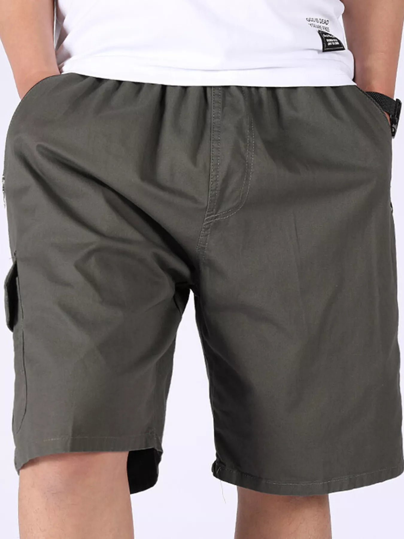 Olive cargo shorts with rear waistband seams and side cargo pocket.