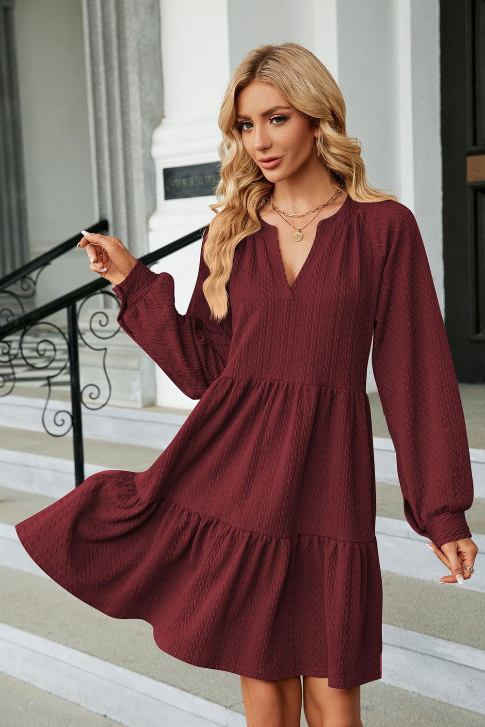 Burgundy notched-neck long-sleeve mini dress with tiered skirt and V-neck