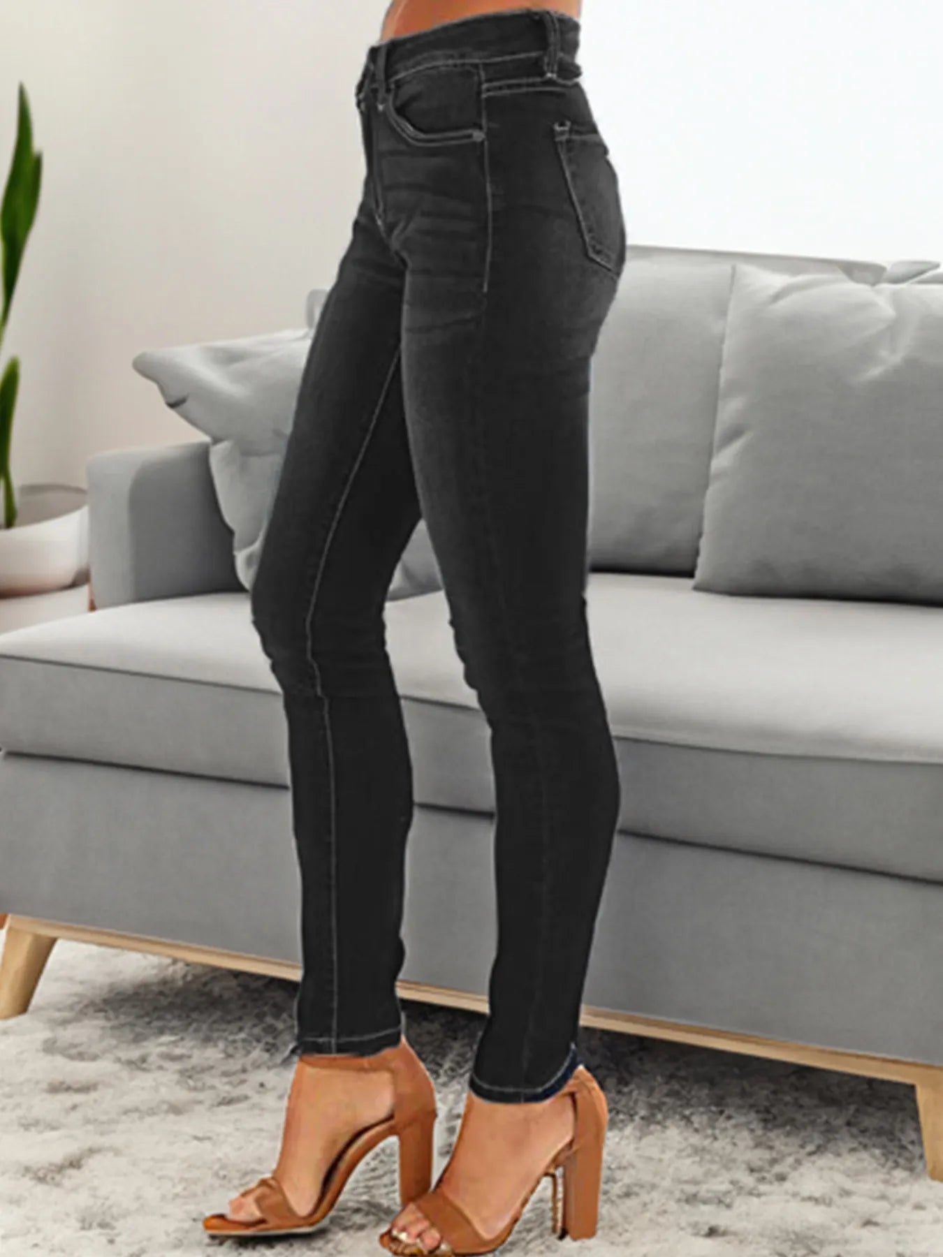 Black skinny fit washed jeans, straight seam front with five pockets and belt loops.