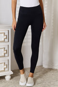 Black sports leggings with wide waistband, full-length, snug fit