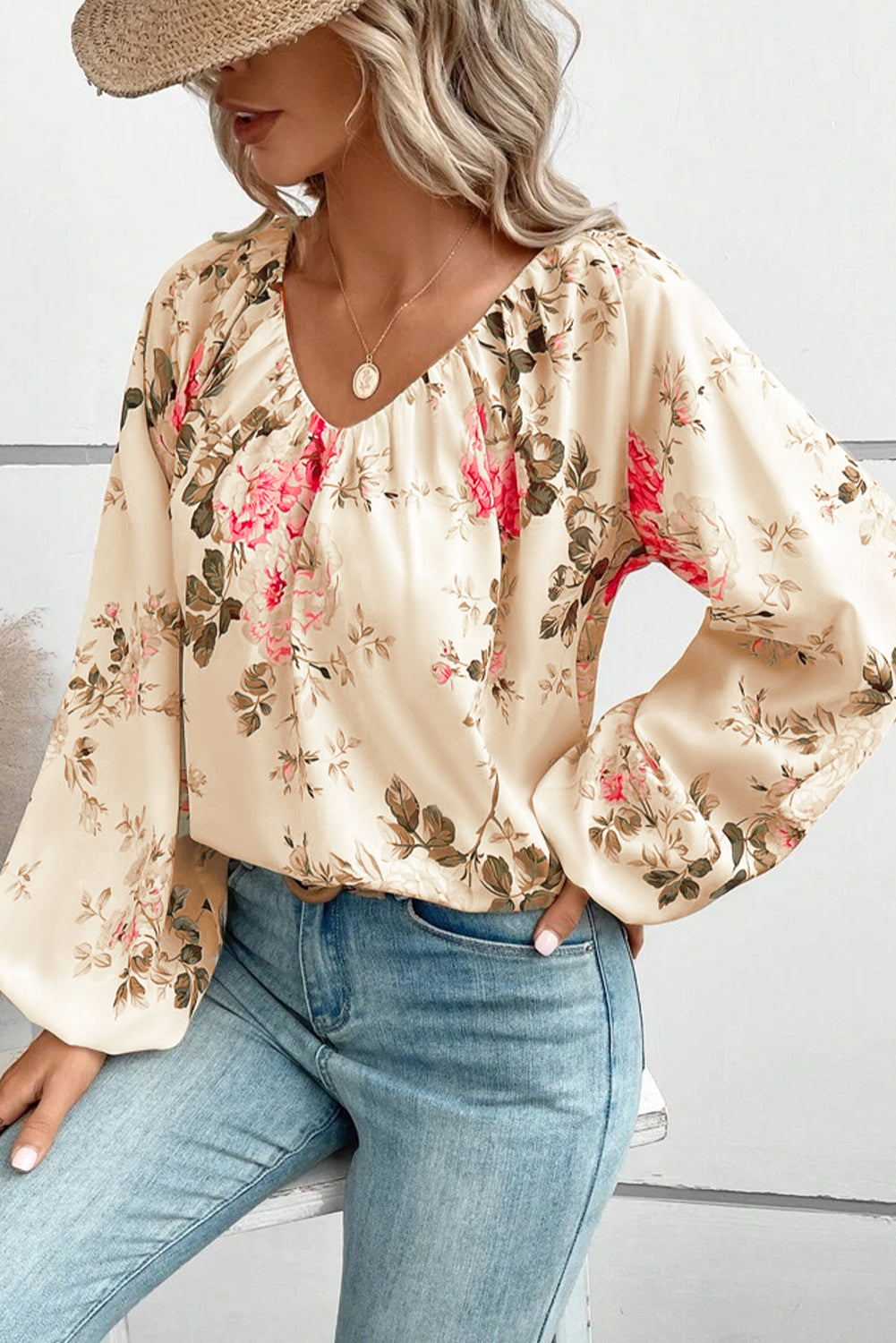 Beige floral V-neck blouse with wide balloon sleeves and elastic cuffs