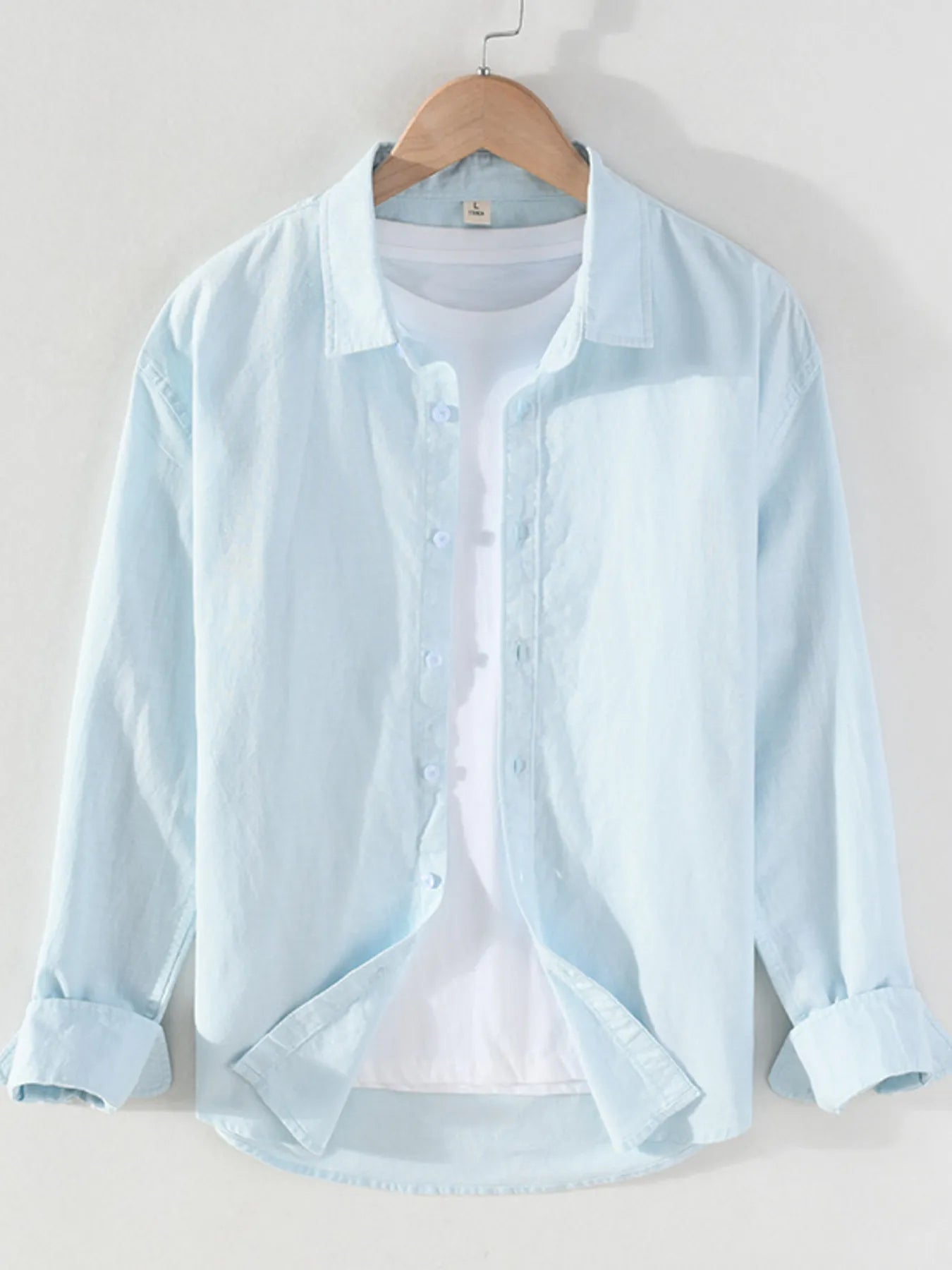 Light blue short-sleeve button-up shirt with point collar and front button placket
