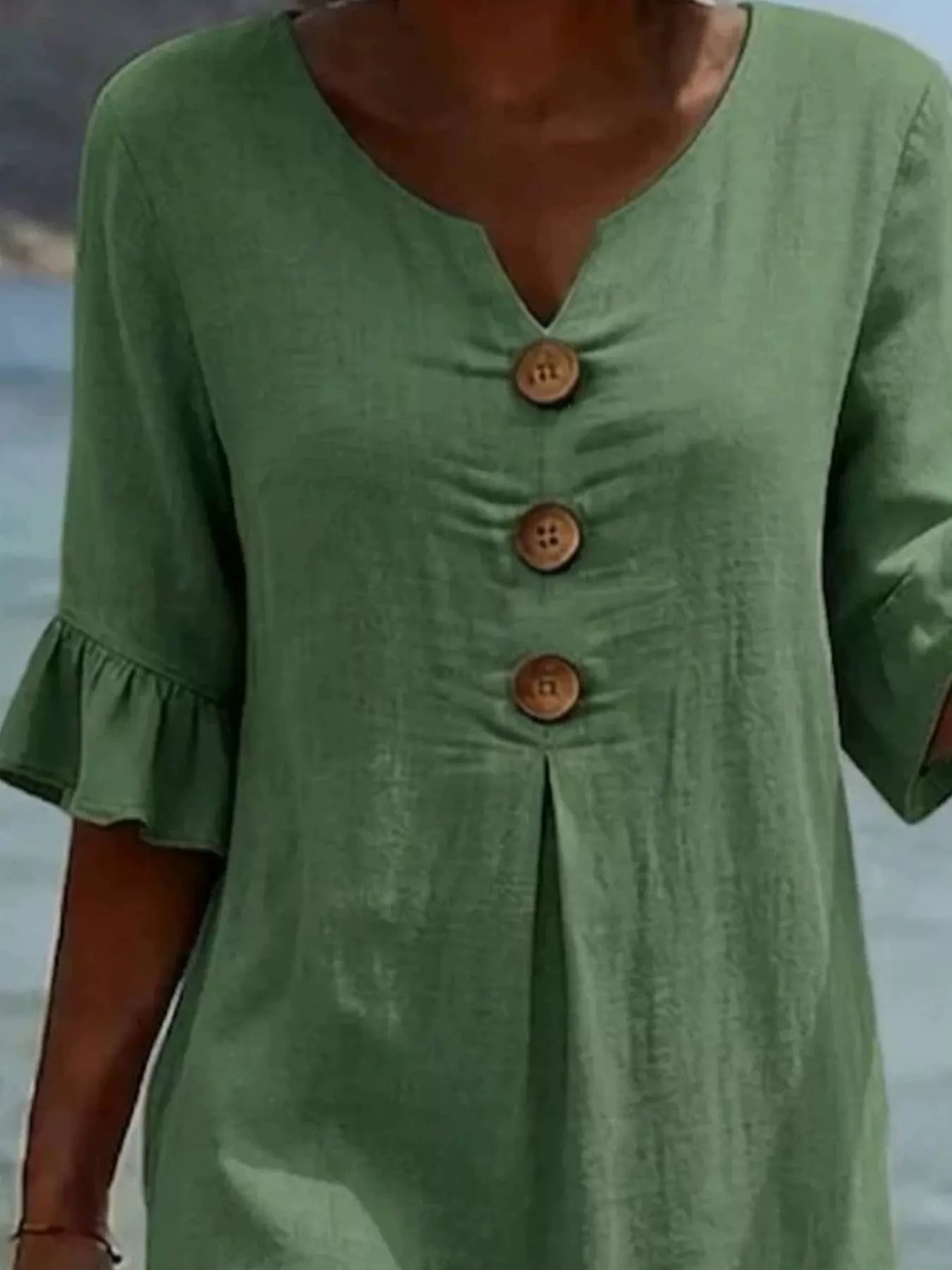 Green V-neck button-front midi dress with ruffle sleeves and three wood-tone buttons