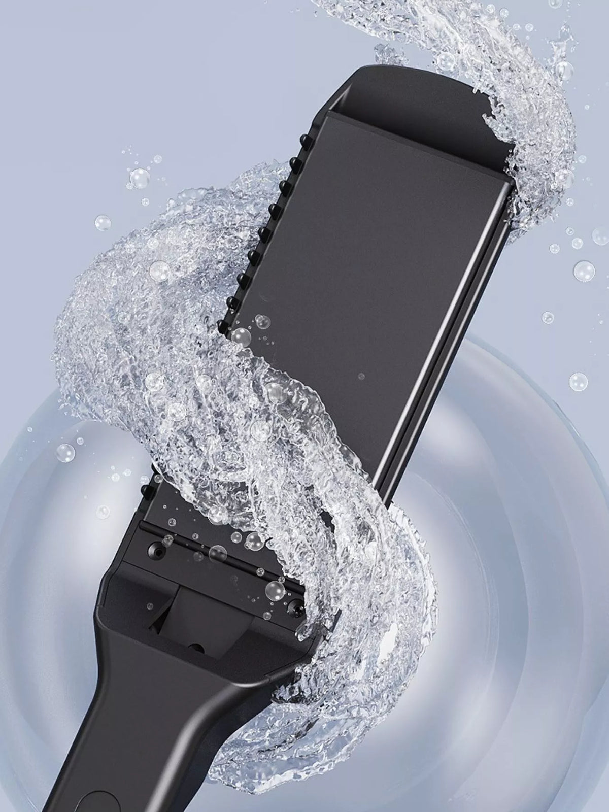 Black hair straightener with water-splash spray over the plates
