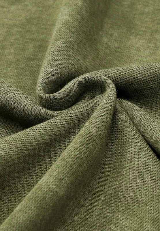 Moss green sweatshirt fabric close-up with soft textured knit