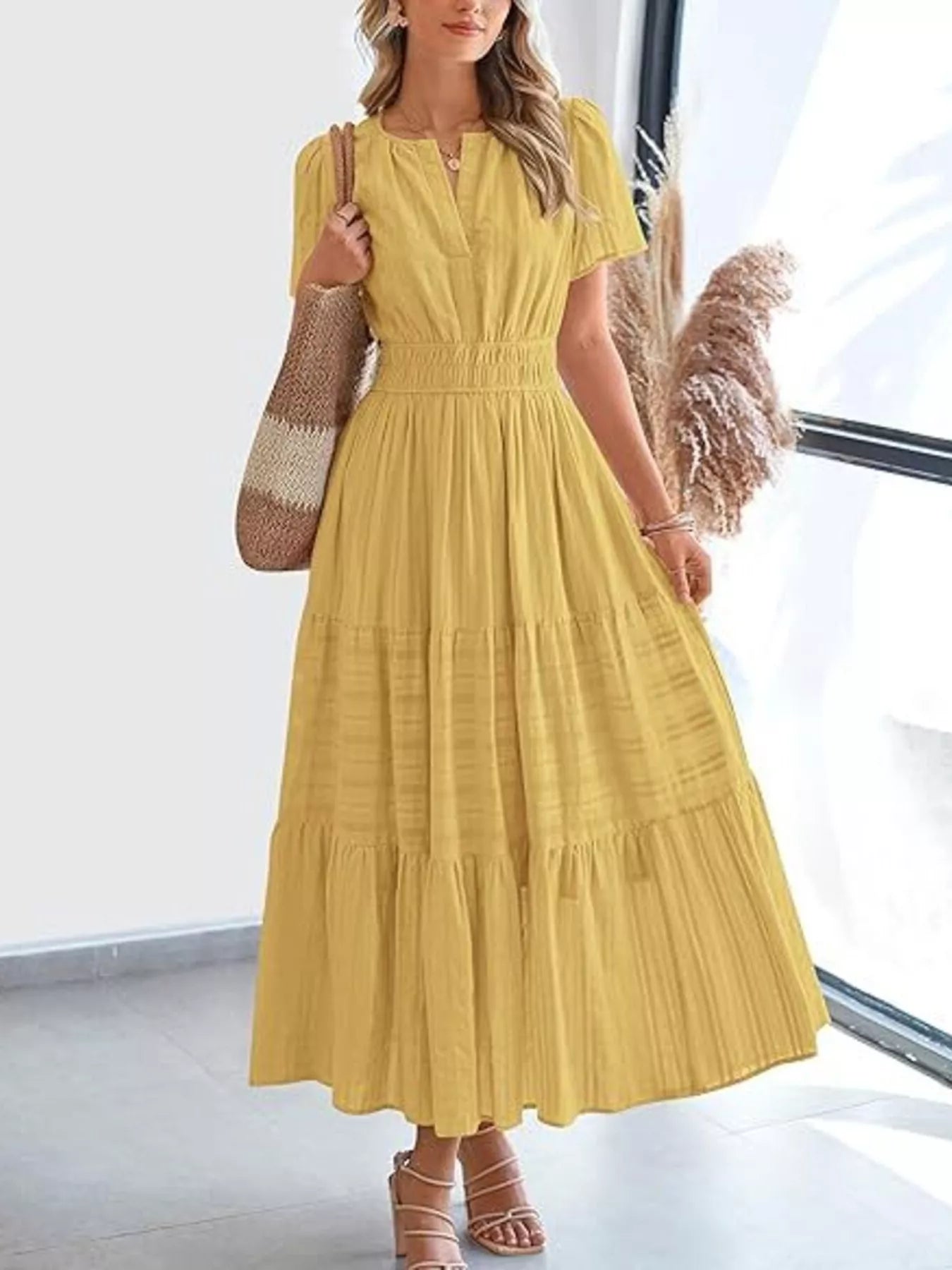 Yellow short sleeve tiered midi dress with V-neck and gathered waist