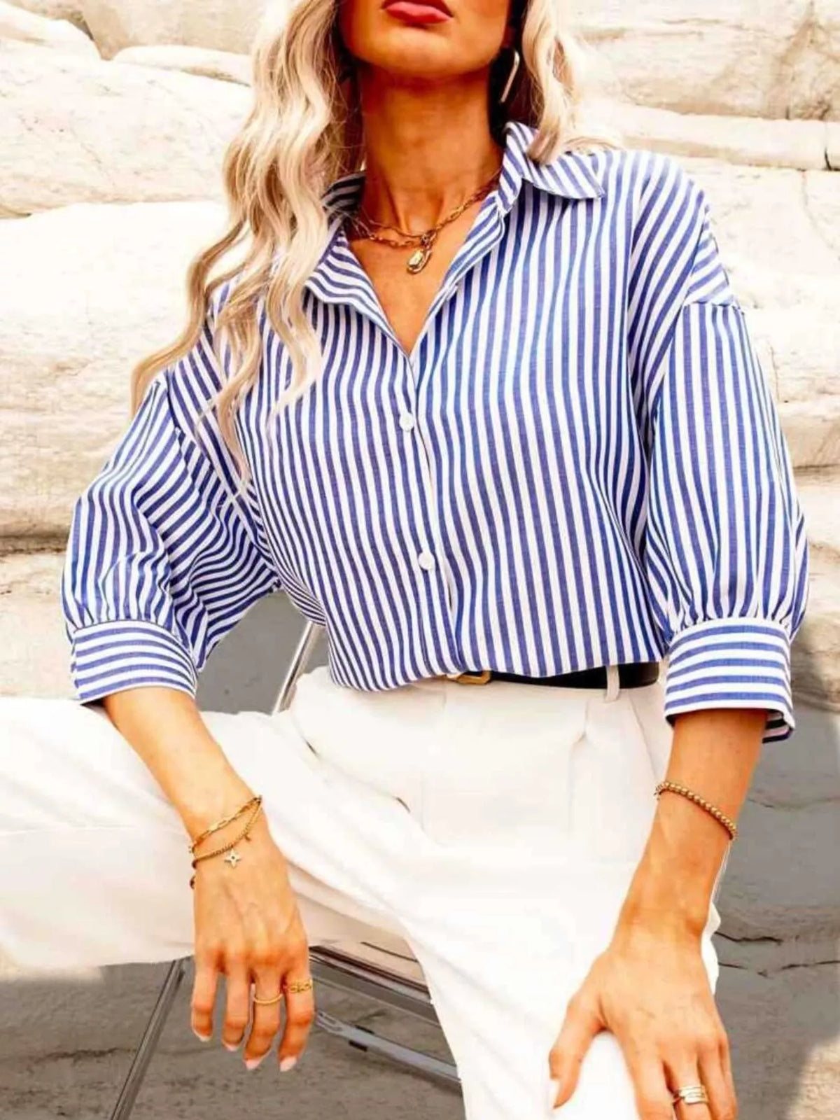 Blue and white striped button-down shirt with relaxed fit and long sleeves