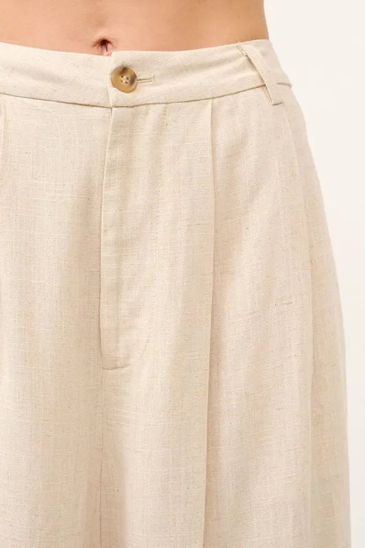 High-rise linen-blend pants waistband in oatmeal with button and pleats detail